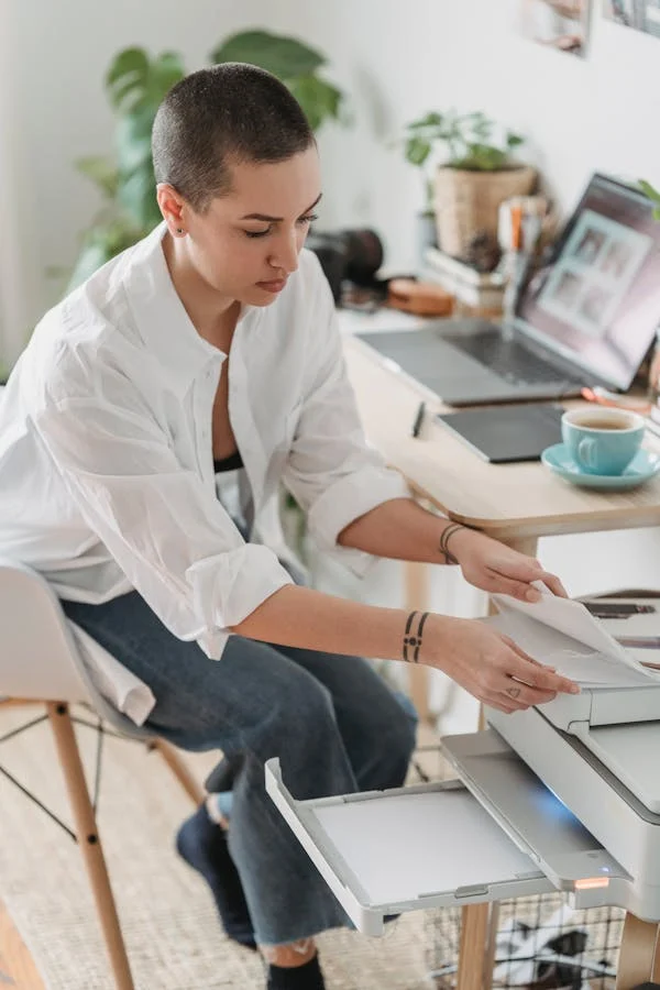 Office staff using Epson printer for professional printing in the UAE